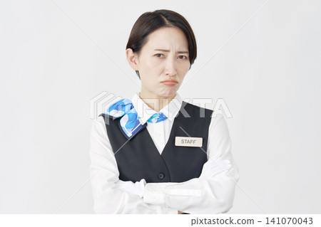 Female staff member, receptionist/bus guide, angry, white background. Female staff member, receptionist/bus guide, angry, white background. 141070043