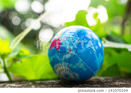 Globe model on green leaf nature background, earth world in forest growth life, care eco system environment sustainable development protect, symbol change save energy technology non carbon recycle. Globe model on green leaf nature background, earth world in forest growth life, care eco system environment sustainable development protect, symbol change save energy technology non carbon recycle. 141070104