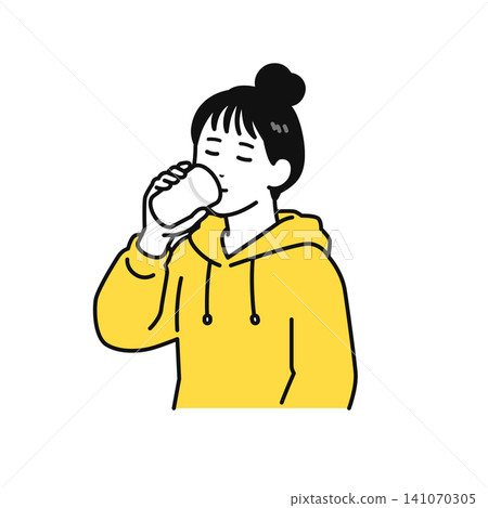 A young woman with her hair tied up drinks water from a glass. A young woman with her hair tied up drinks water from a glass. 141070305