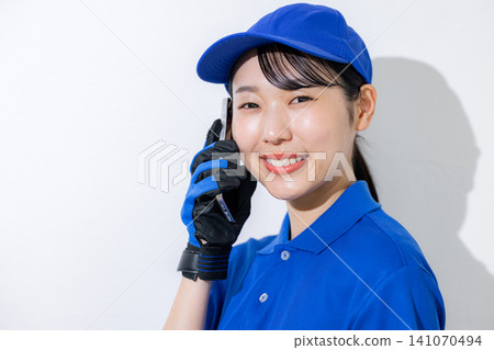 Female staff with smartphone Female staff with smartphone 141070494