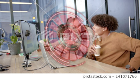 Leaning male wearing tan sweater and watch holding paper cup coworking desk with HUD, copy space Leaning male wearing tan sweater and watch holding paper cup coworking desk with HUD, copy space 141071766