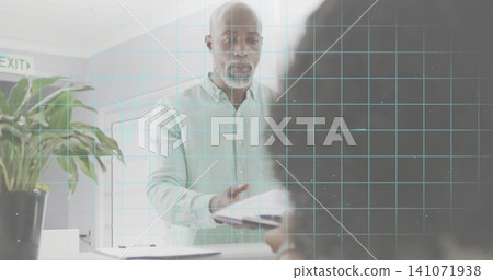 Senior receptionist in light shirt handing document across counter, plant and EXIT sign, grid Senior receptionist in light shirt handing document across counter, plant and EXIT sign, grid 141071938