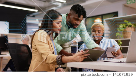 Reviewing three colleagues examining tablet in open office, tan blazer, circuit overlay Reviewing three colleagues examining tablet in open office, tan blazer, circuit overlay 141071939