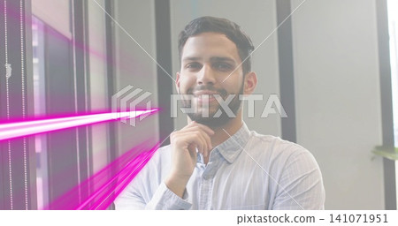 Standing man in light blue shirt resting chin on hand in office, blinds and magenta streaks Standing man in light blue shirt resting chin on hand in office, blinds and magenta streaks 141071951