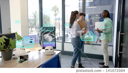 Discussing project woman wearing blouse, jeans and ankle boots with team in office, laptop VR Discussing project woman wearing blouse, jeans and ankle boots with team in office, laptop VR 141072084