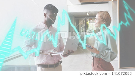 Showing pair in light shirts holding laptop and phone by glass railing, holographic turquoise graph Showing pair in light shirts holding laptop and phone by glass railing, holographic turquoise graph 141072093