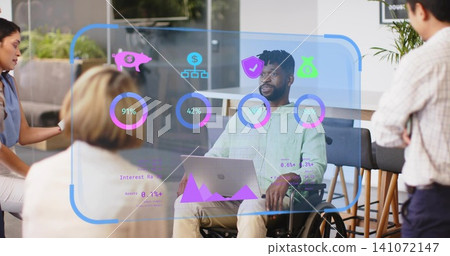 Presenting man in wheelchair wearing green shirt, using laptop with AR charts in modern office Presenting man in wheelchair wearing green shirt, using laptop with AR charts in modern office 141072147