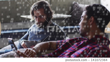 Comparing bearded man in gray sweater and plaid shirt checking smartphones at home, binary overlay Comparing bearded man in gray sweater and plaid shirt checking smartphones at home, binary overlay 141072364
