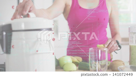 Preparing Korean woman pressing juicer lid at kitchen counter in pink tank top with blender jar Preparing Korean woman pressing juicer lid at kitchen counter in pink tank top with blender jar 141072449