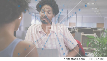 Making playful face man in pink-striped shirt talking at open-plan office with laptop, blue overlay Making playful face man in pink-striped shirt talking at open-plan office with laptop, blue overlay 141072488