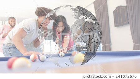 Leaning woman in red top aiming cue on blue-felt pool table at home, group watching globe Leaning woman in red top aiming cue on blue-felt pool table at home, group watching globe 141072676