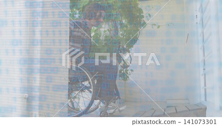 Framing leafy plant with vines partially obscuring bicycle wheel on small porch, binary overlay Framing leafy plant with vines partially obscuring bicycle wheel on small porch, binary overlay 141073301