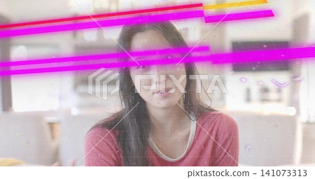 Sitting woman wearing white-trim longsleeve top facing camera on sofa at home, with magenta streaks Sitting woman wearing white-trim longsleeve top facing camera on sofa at home, with magenta streaks 141073313