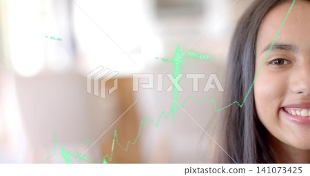 Smiling teen showing right face at dining wearing dark top with green chart labels, copy space 141073425