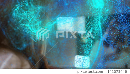 Shrouding adult female behind glass at studio, teal particle cloud with bright lights, copy space Shrouding adult female behind glass at studio, teal particle cloud with bright lights, copy space 141073446