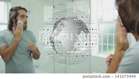 Applying shaving foam, man in light grey tee at bathroom vanity, wall mirror showing digital globe Applying shaving foam, man in light grey tee at bathroom vanity, wall mirror showing digital globe 141073449