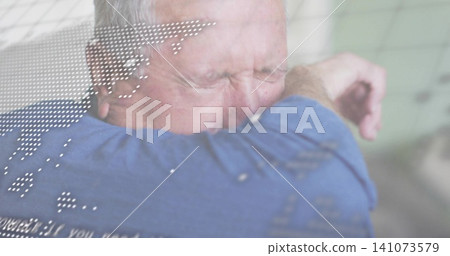 Coughing senior male covering face with arm in cabin, with blue long-sleeve shirt and data overlay Coughing senior male covering face with arm in cabin, with blue long-sleeve shirt and data overlay 141073579