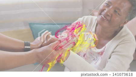 Holding mid adult woman supporting senior woman's hands on sofa at home with watch, magenta swirls Holding mid adult woman supporting senior woman's hands on sofa at home with watch, magenta swirls 141073618