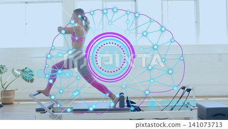 Lunging woman in pink sports bra magenta leggings on Pilates reformer at studio with AI overlay Lunging woman in pink sports bra magenta leggings on Pilates reformer at studio with AI overlay 141073713