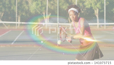 Returning tennis player swinging racket, meeting ball near net at court in pink top, copy space Returning tennis player swinging racket, meeting ball near net at court in pink top, copy space 141073715