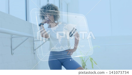 Leaning woman with elbow on barre in bright studio, wearing white top and blue shorts, HUD Leaning woman with elbow on barre in bright studio, wearing white top and blue shorts, HUD 141073734