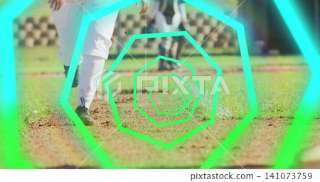 Stepping athlete lower body wearing white pants and black cleats on dirt infield, neon overlay Stepping athlete lower body wearing white pants and black cleats on dirt infield, neon overlay 141073759