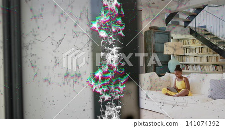 Sitting child in yellow dress using tablet on sectional sofa in loft, glitch overlay, copy space Sitting child in yellow dress using tablet on sectional sofa in loft, glitch overlay, copy space 141074392