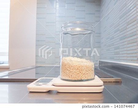 Measuring rice koji using a kitchen scale Measuring rice koji using a kitchen scale 141074467