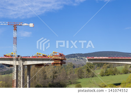 Bridge construction progressing over Bernartice, Czechia valley Bridge construction progressing over Bernartice, Czechia valley 141074552