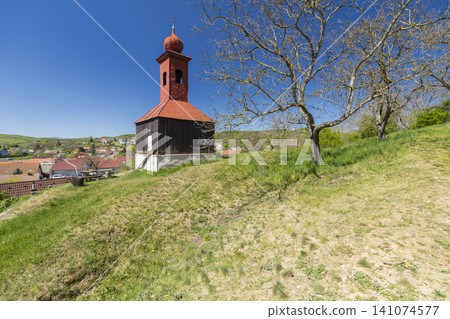 Village belfry on a hill overlooking Moravske Branice Village belfry on a hill overlooking Moravske Branice 141074577