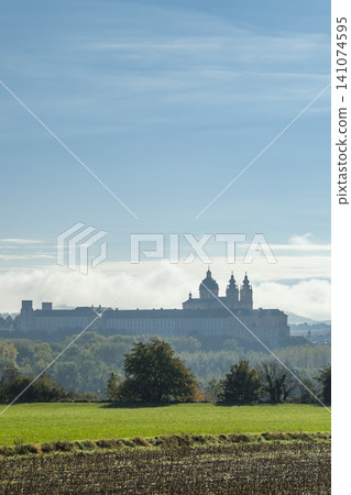 Melk Abbey rising above fog in Lower Austria Melk Abbey rising above fog in Lower Austria 141074595
