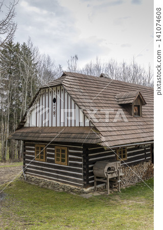 Traditional Vesely Kopec wooden cottage showcasing Czech folk architecture Traditional Vesely Kopec wooden cottage showcasing Czech folk architecture 141074608