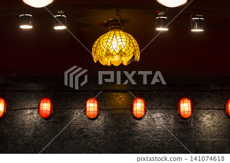 Illuminated lamps creating warm ambiance in dark interior Illuminated lamps creating warm ambiance in dark interior 141074618