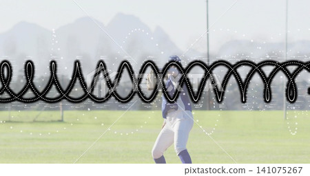 Standing softball player on grassy field, wearing navy uniform, behind black waveform overlay Standing softball player on grassy field, wearing navy uniform, behind black waveform overlay 141075267