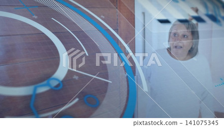 Looking startled senior woman in white top behind glass in hallway, HUD rings overlay, copy space Looking startled senior woman in white top behind glass in hallway, HUD rings overlay, copy space 141075345