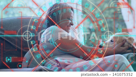 Cradling senior woman leaning toward light-colored dog on living room couch, with AR HUD overlay 141075352