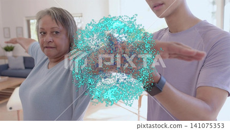 Guiding man in purple tee helping senior extending arm in therapy showing turquoise effect, tracker Guiding man in purple tee helping senior extending arm in therapy showing turquoise effect, tracker 141075353