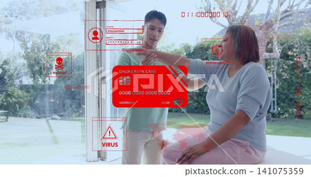 Pointing adult son and seated mother examining red card overlay at home doorway, malware warnings Pointing adult son and seated mother examining red card overlay at home doorway, malware warnings 141075359
