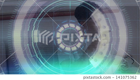 Standing adult male facing right in interior room, wearing light shirt under ring light HUD Standing adult male facing right in interior room, wearing light shirt under ring light HUD 141075362