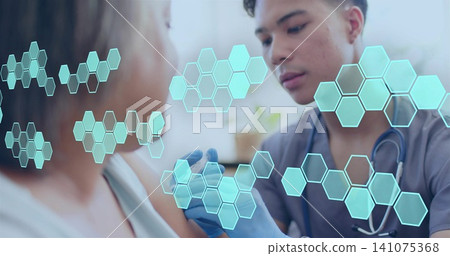 Injecting nurse in scrubs placing syringe into older woman's arm in clinic, gloves, cyan overlays Injecting nurse in scrubs placing syringe into older woman's arm in clinic, gloves, cyan overlays 141075368