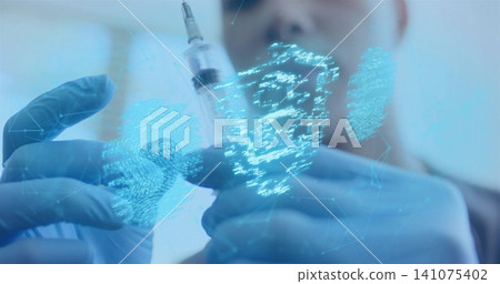 Holding syringe and vial, man wearing blue nitrile gloves projecting biometric hologram in lab Holding syringe and vial, man wearing blue nitrile gloves projecting biometric hologram in lab 141075402