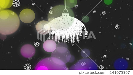 Hanging white ornament from dotted string featuring pine cutout, dark holiday background with bokeh Hanging white ornament from dotted string featuring pine cutout, dark holiday background with bokeh 141075507