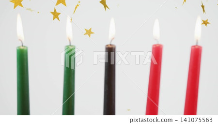 Flickering five tapered candles with visible flames and melted wax, glowing in studio backdrop Flickering five tapered candles with visible flames and melted wax, glowing in studio backdrop 141075563