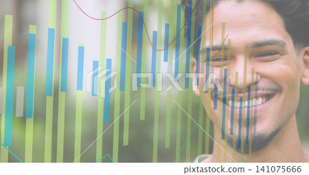 Smiling adult male wearing light shirt showing green-blue bars, line-graphs over garden, copy space Smiling adult male wearing light shirt showing green-blue bars, line-graphs over garden, copy space 141075666