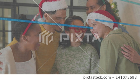 Smiling five coworkers leaning at office lounge, wearing Santa hats, antlers, REDACTED stripe Smiling five coworkers leaning at office lounge, wearing Santa hats, antlers, REDACTED stripe 141075698
