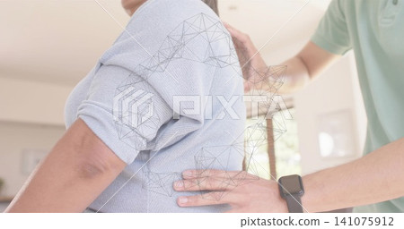 Supporting man placing hands on senior back at home, light-blue-knit-top, wireframe, smartwatch Supporting man placing hands on senior back at home, light-blue-knit-top, wireframe, smartwatch 141075912