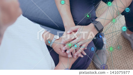 Holding man dark trousers and senior woman white top on sofa, showing watches and network overlay Holding man dark trousers and senior woman white top on sofa, showing watches and network overlay 141075977
