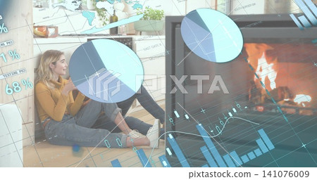 Sitting two women leaning at home by fireplace, wearing mustard sweater, holding mug, data overlays 141076009