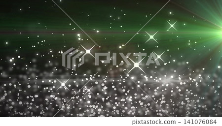 Sparkling white bokeh field and star-like lens flares glowing on abstract green backdrop Sparkling white bokeh field and star-like lens flares glowing on abstract green backdrop 141076084