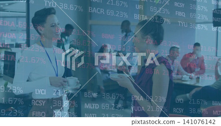Chatting two women wearing business wear and lanyards with cups in office breakroom, ticker overlay Chatting two women wearing business wear and lanyards with cups in office breakroom, ticker overlay 141076142